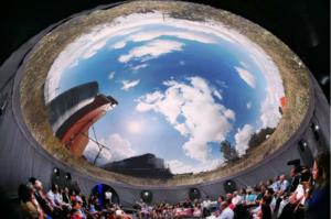 Image of audience watching 360 degree film in a dome